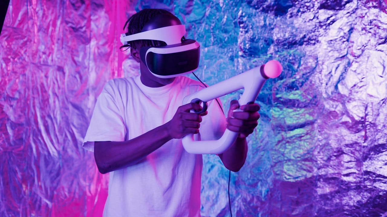 A person engaged in virtual reality gaming with neon lights enhancing the ambiance.